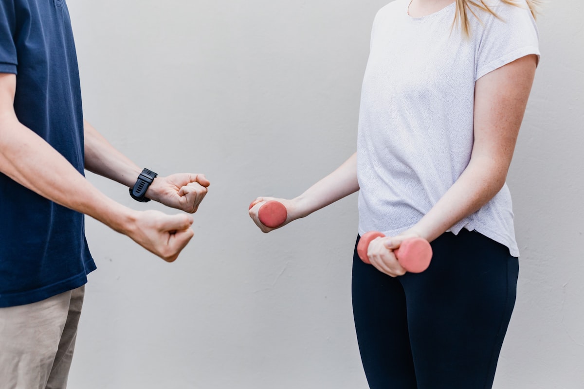 Professional rehabilitation specialist guiding a patient through therapeutic movement